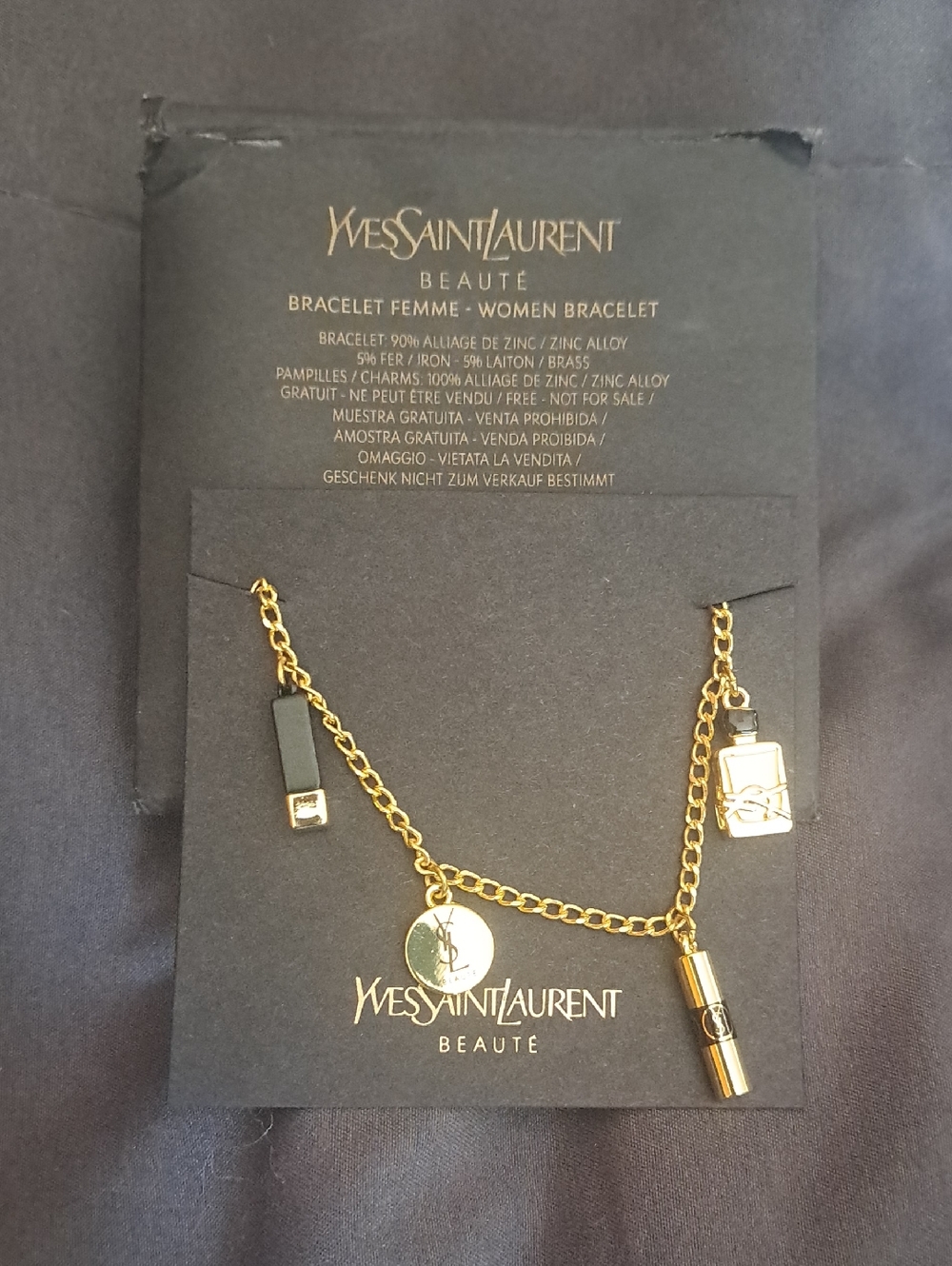 Yves Saint Laurent Gold Charm Bracelet with Black Accents